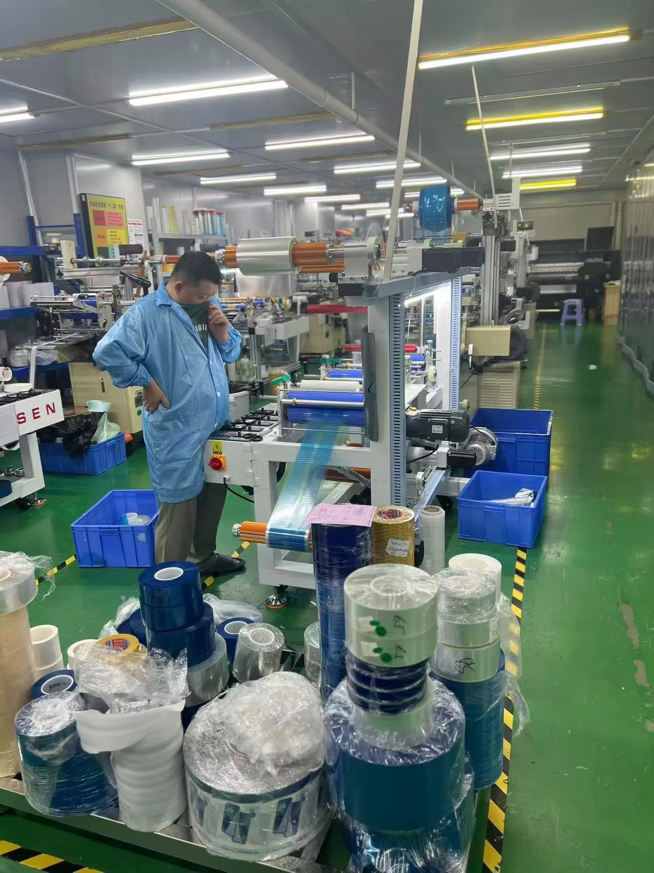 Team member working beside production machinery